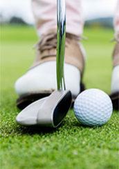 Golfer lining up a putt